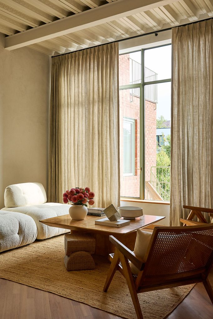 Beige Olivia Pleat Drapery in a neutral living room.