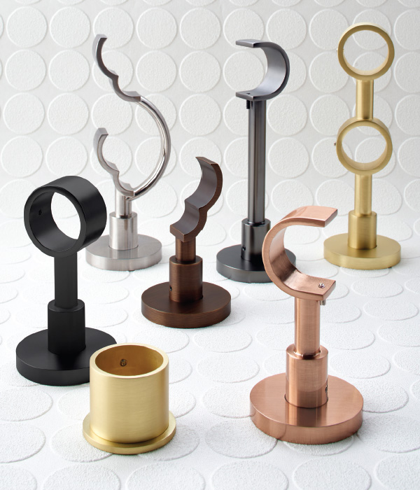 An assortment of brackets for single and double rods from Paris Texas Hardware.