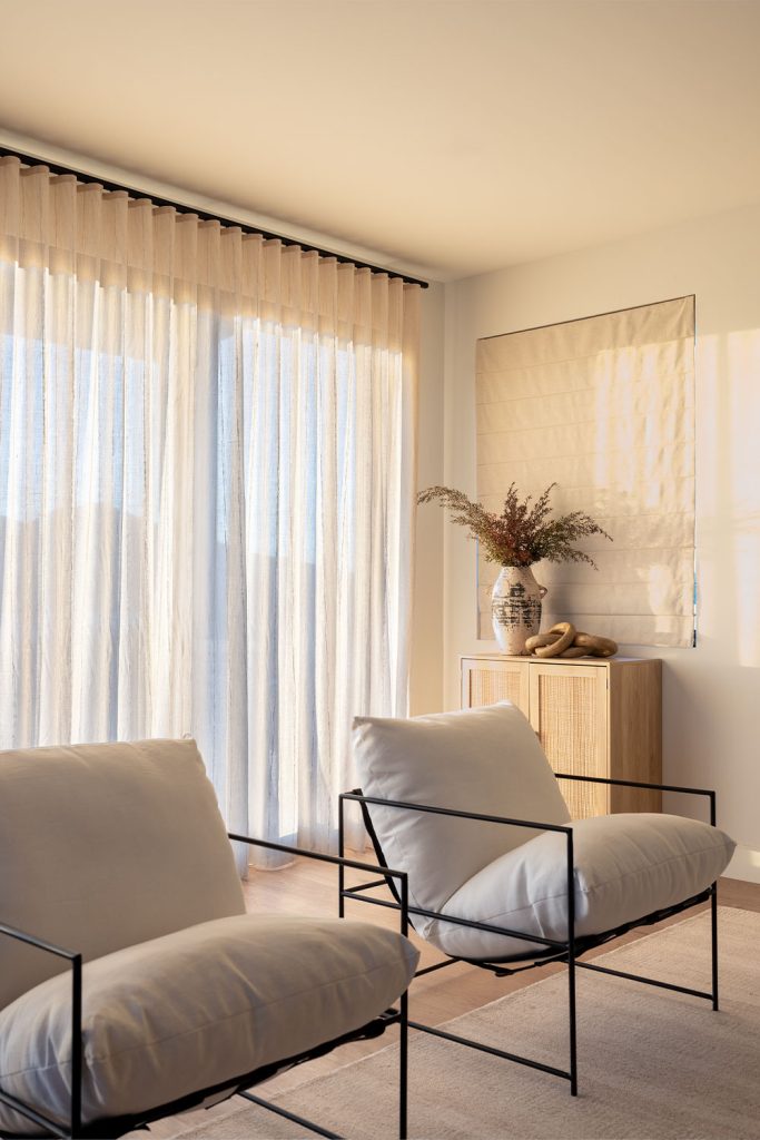 Sheer Ripplefold Drapery at sunset in the living room.